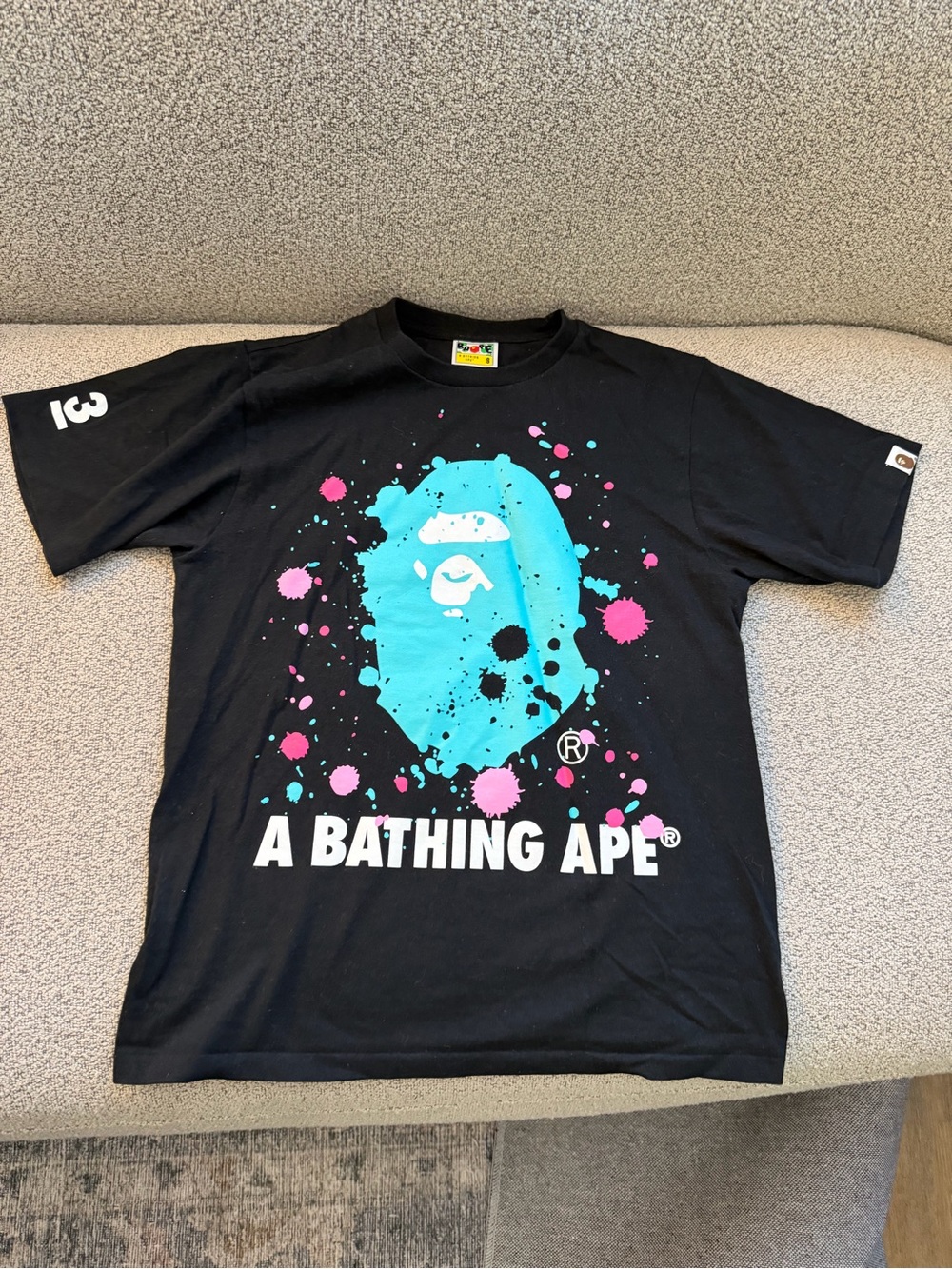 A Bathing Ape Black Graphic Tee with Aqua & Pink Splatter